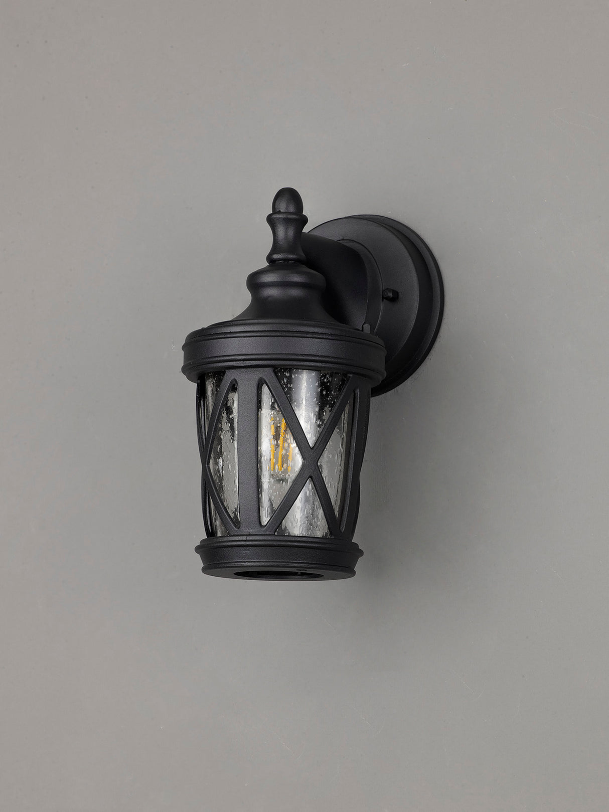 Stuckey Down Round Criss Cross Wall Lamp, 1 x E27, IP44, Sand Black/Clear Seeded Glass, 2yrs Warranty