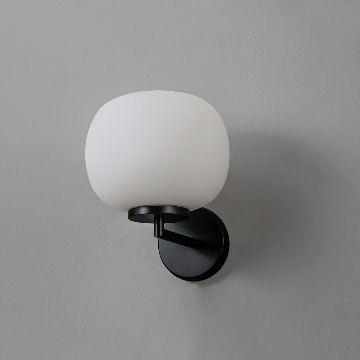 Cunnington Small Oval Ball Wall Light 1 Light E27 Matt Black Base With Frosted White Glass Globe